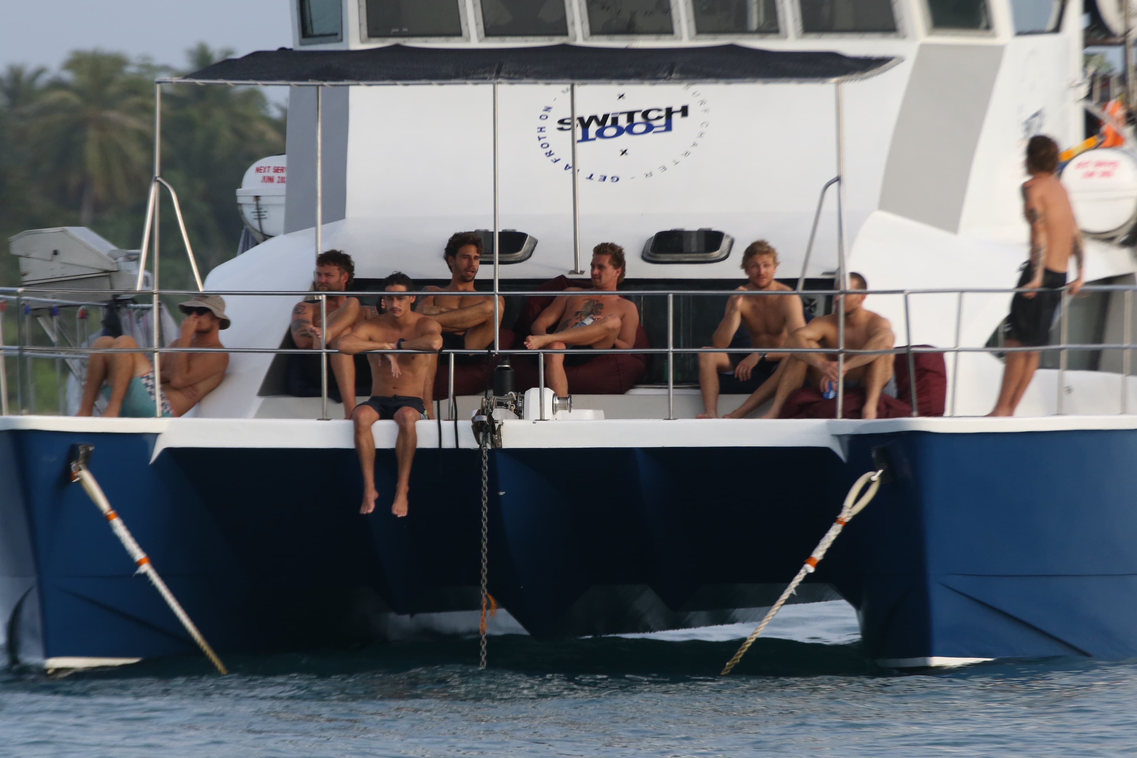 The crew sitting on the charter boat in the Mentawai Islands