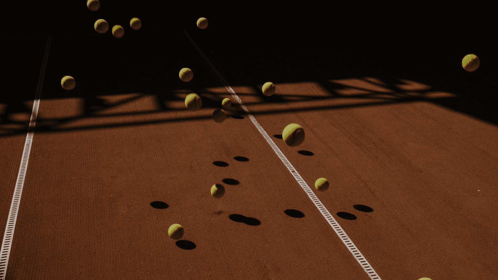 Tennis balls on clay court